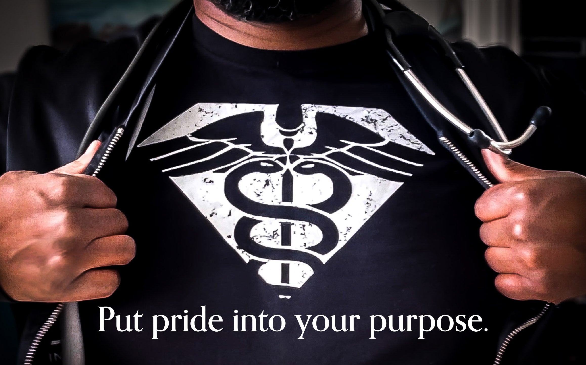 Person wearing a black shirt with a white symbol and text 'Put pride into your purpose'.
